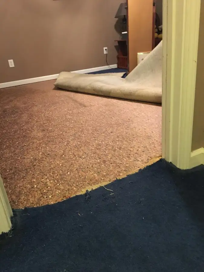 Carpet pad removal revealing water damage during Water Mitigation Services in Toppenish